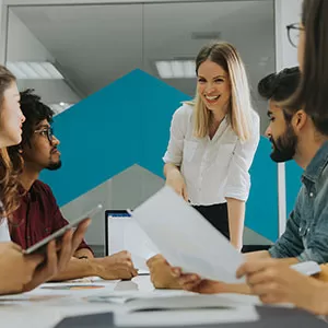 Student reading book in library wearing mask