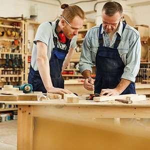 Student reading book in library wearing mask