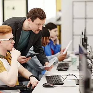 Student reading book in library wearing mask