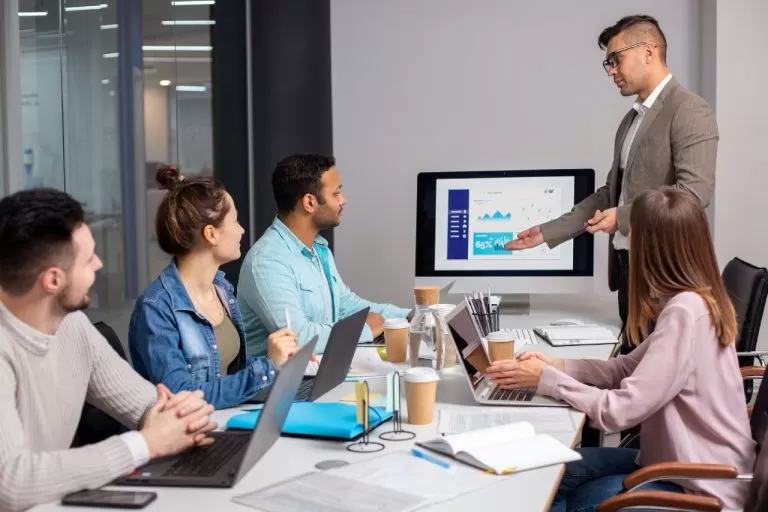 Business presentation with a man presenting to a team