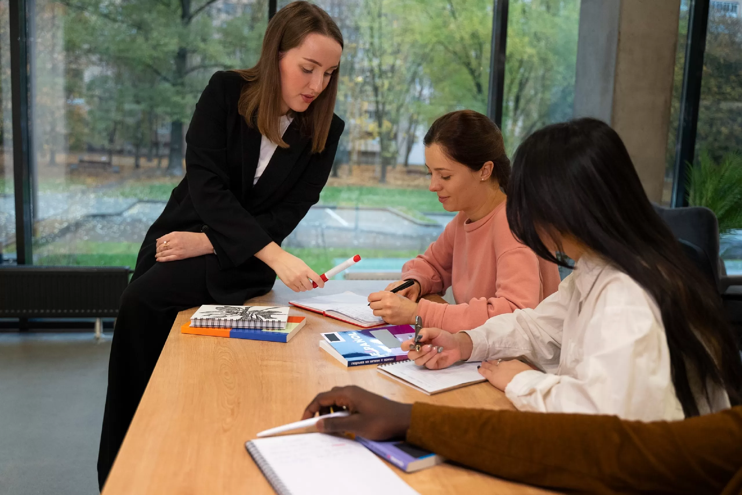 Business women meeting and discussing documents at a table