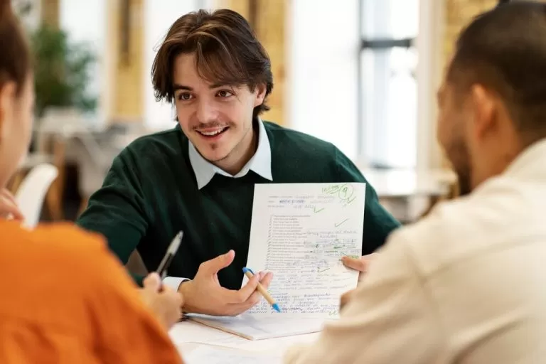 Customer service team with headsets smiling in office