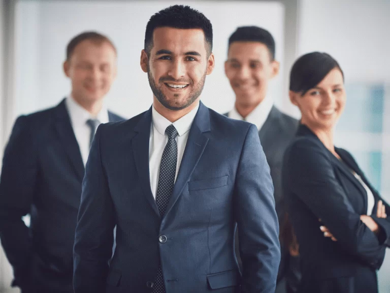 Customer service team with headsets smiling in office